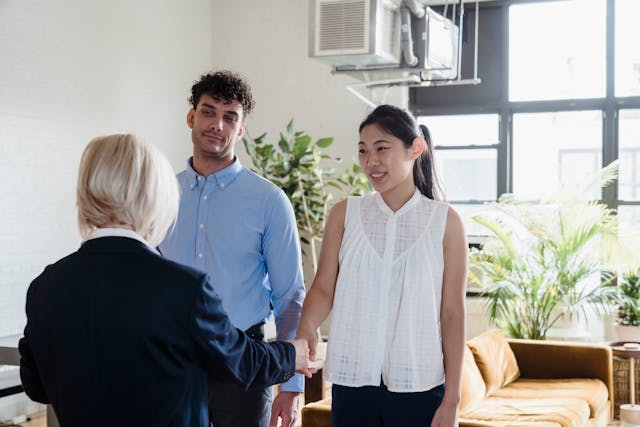 a property manager conducting a property showing with two tenants